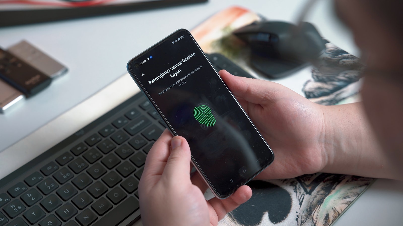 Phone showing a fingerprint unlock screen