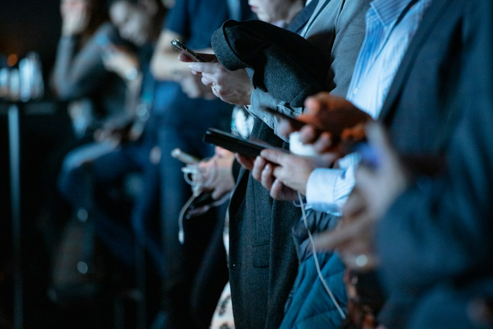 People in a crowd using their phones