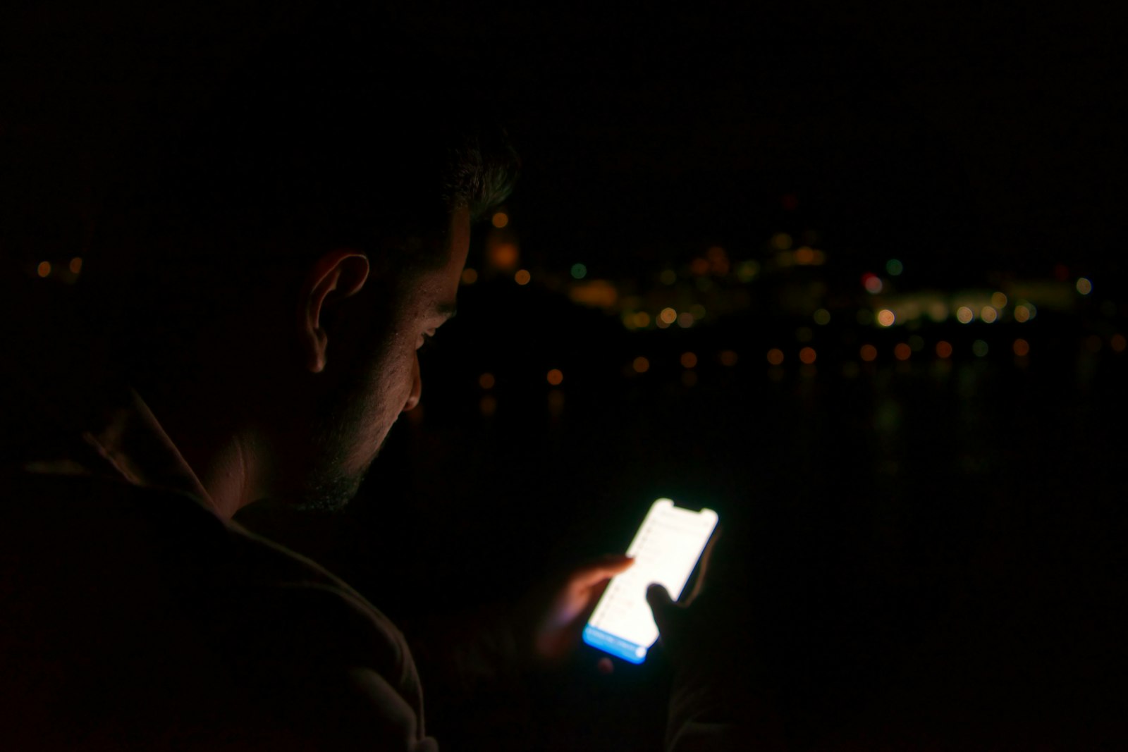 Person using a phone at night — the decision happens on your device