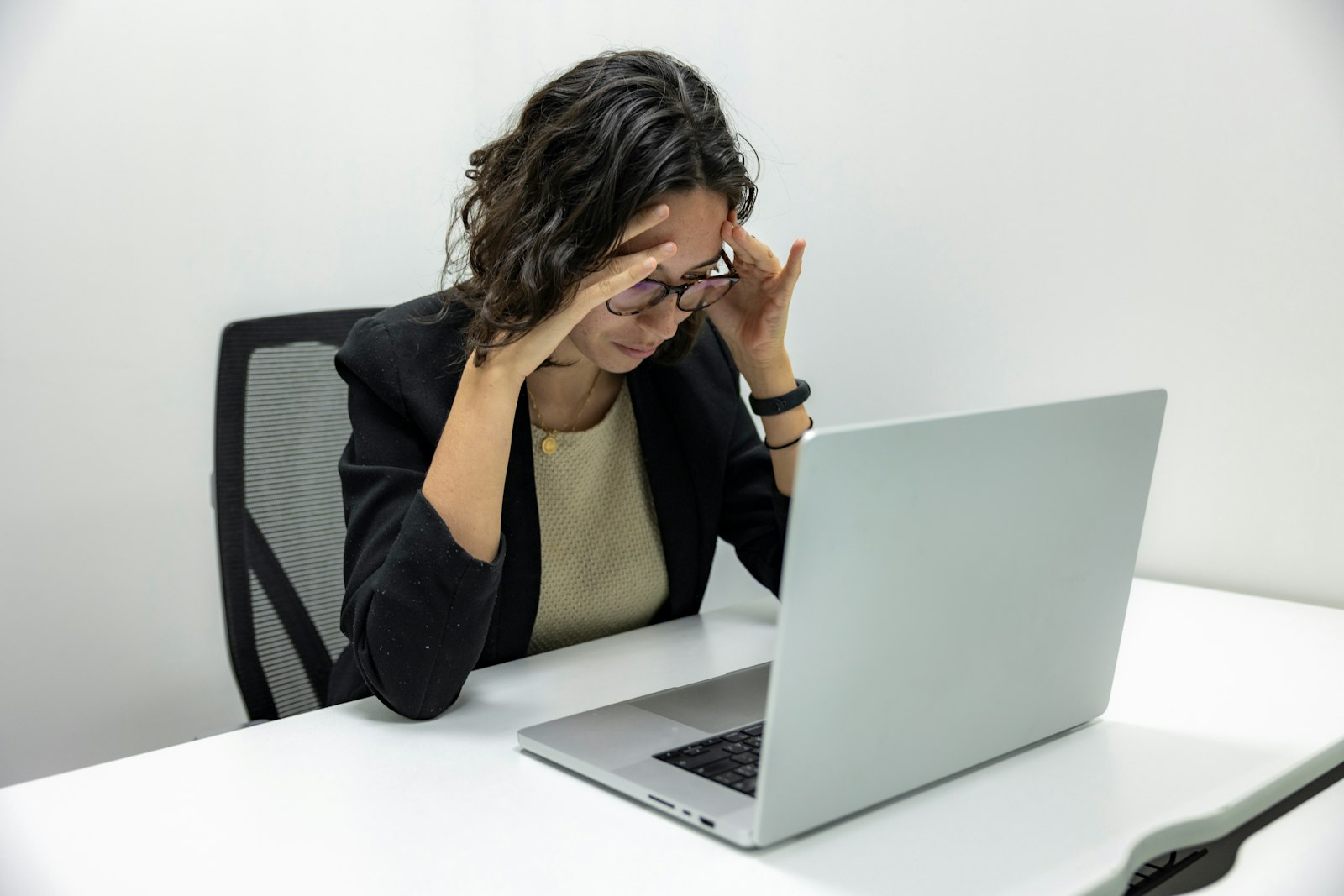 Frustrated person in front of a laptop